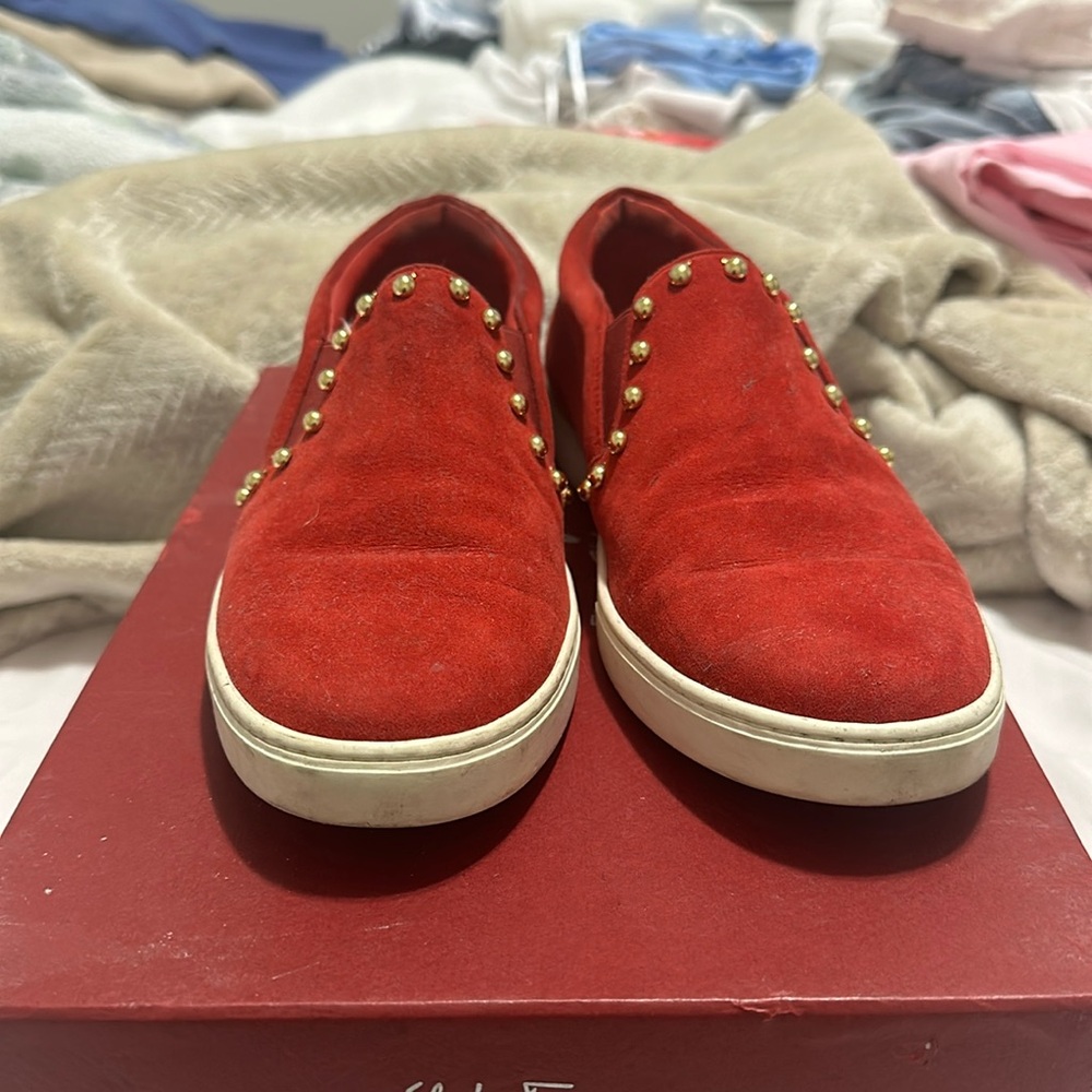 These are Salvatore Ferragamo slip on sneakers.